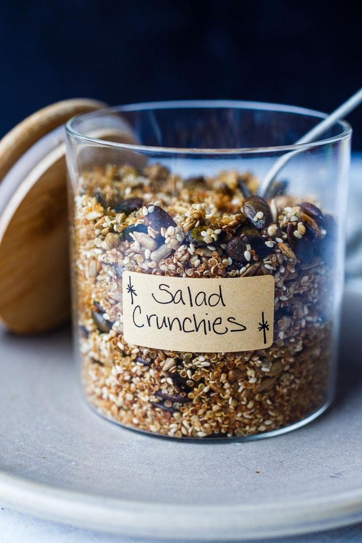 a jar filled with granola sitting on top of a plate