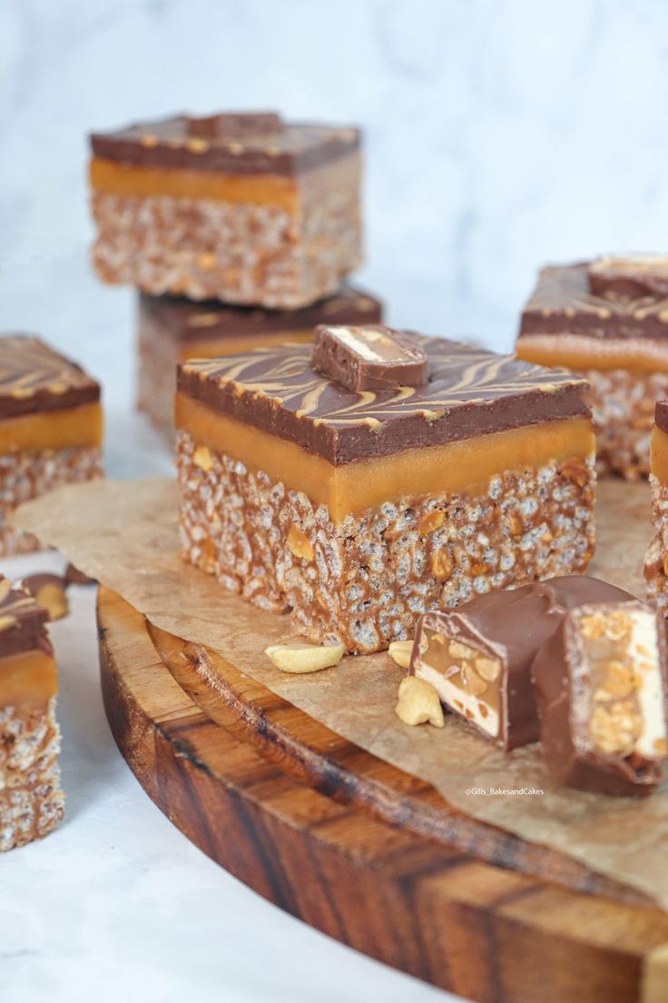 several pieces of chocolate and nuts on a cutting board