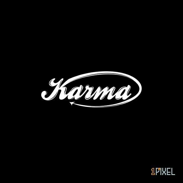 the word karma written in white ink on a black background