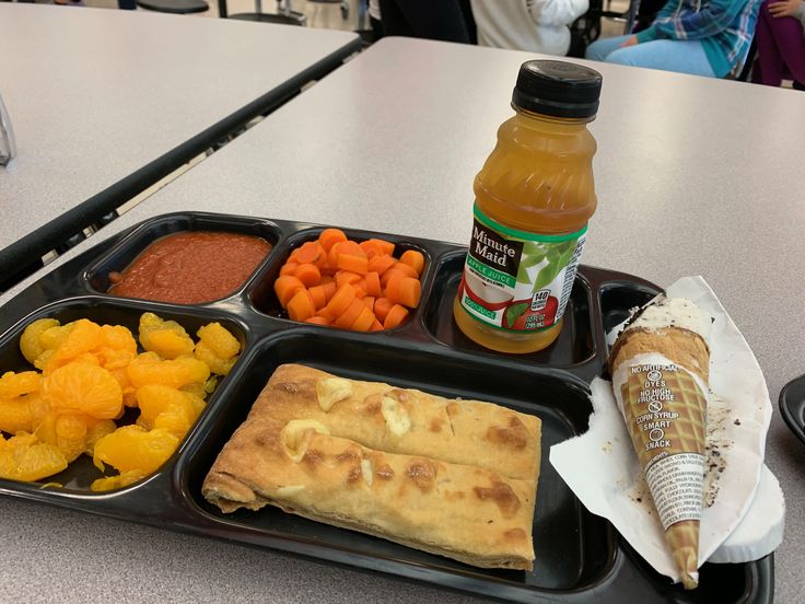 a black tray topped with lots of food