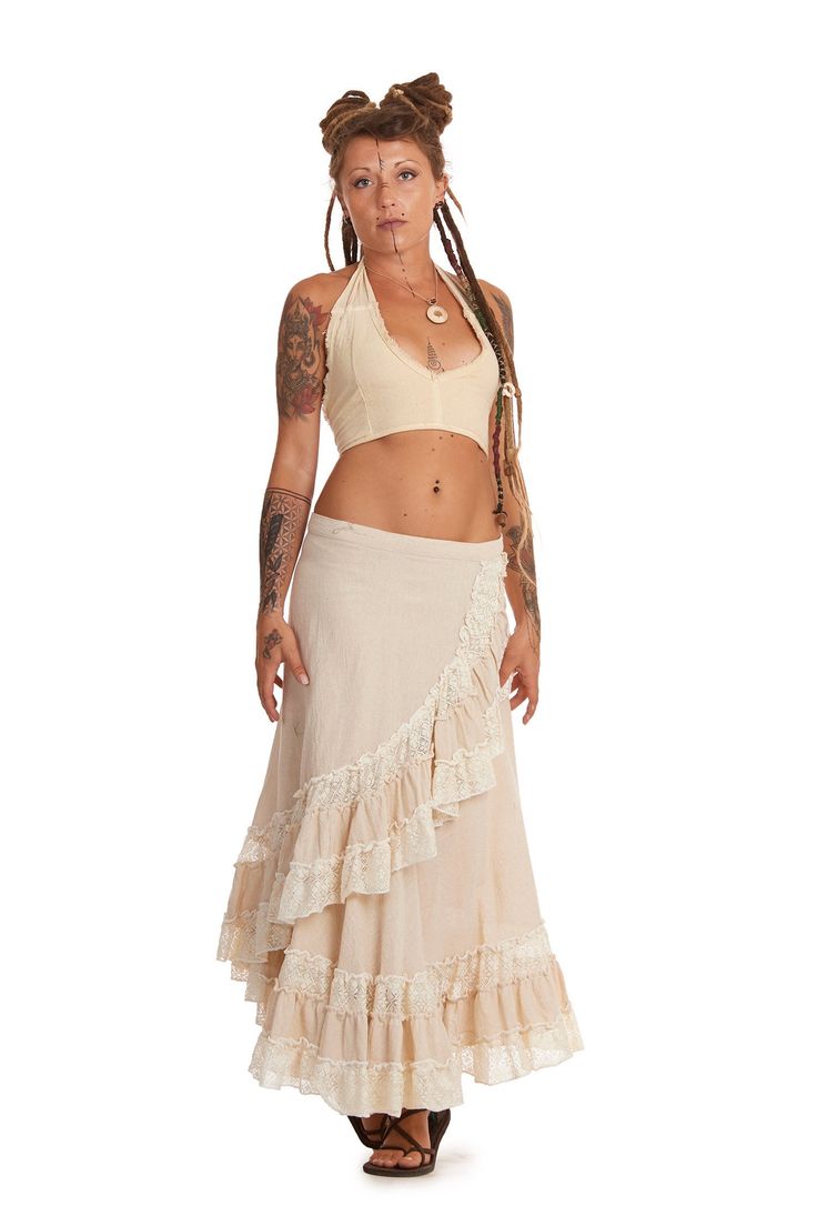 "A long wrap skirt fit for a festival goddess! Beautiful, natural jute cotton and cotton lace make up a skirt that is comfy and super fun to wear. It wraps at the waist to fit a wide range of sizes.  SIZE  ONE SIZE Waist = 28-38\" (71-96.5 cm) Length = 33\" (84 cm) THIS LISTING IS FOR CREAM Also available in Masala, Army, Black or Pink. Code: JUTE LUCY SKIRT (ROKJLWR)" Hippie Cotton Wrap Skirt For Beach, Cotton Hippie Wrap Skirt For The Beach, Fitted Beige Skirt For Festivals, Beige Cotton Skirt With Lace Trim, Bohemian Lace Maxi Skirt For Beach, Bohemian Cotton Wrap Skirt For Summer, Summer Bohemian Cotton Wrap Skirt, Bohemian Lace Trim Festival Skirt, Bohemian Lace Trim Skirt For Festivals