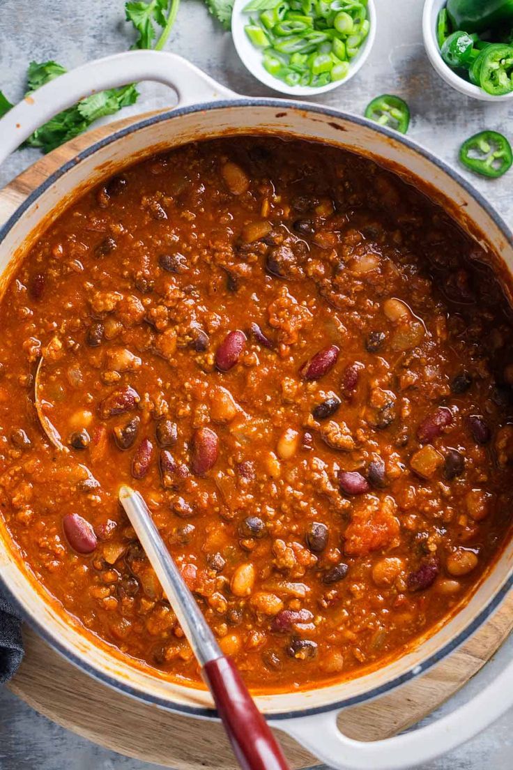 a large pot filled with chili and beans