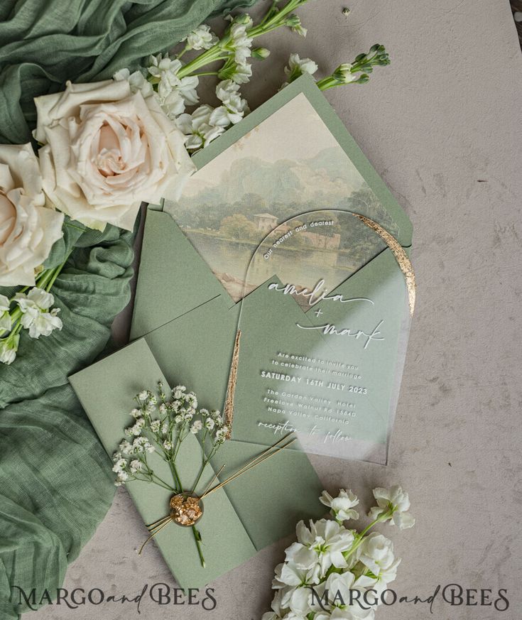 wedding stationery with white flowers and greenery