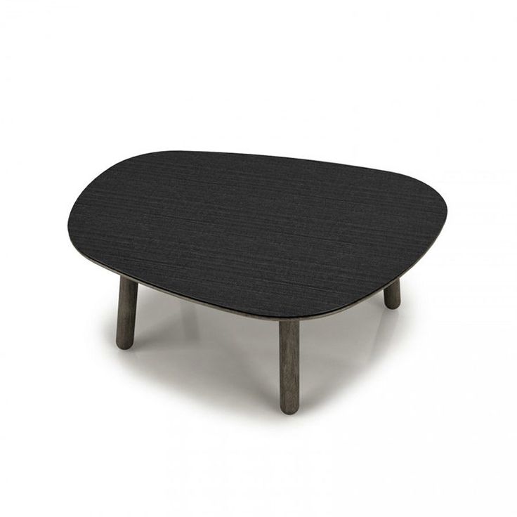 a black table sitting on top of a white floor next to a wooden legrest