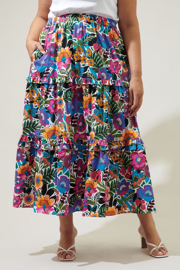 A little artsy floral action never hurt anyone. Complementary flower motifs work together to create the Santa Elena print. It decorates a tiered maxi skirt with ruffle trim. An elastic waist tops a flowy fit with side pockets. Wear it with a solid tank and sandals for an effortless, boho look.- Elastic waist- Pockets- Ruffle trim- Flowy fit- Color: Floral MultiSize + Fit - Model is 5'8" and wearing size XS- Measurements taken from size S - Waist: 17"- Length: 39 1/4" Fabric Self: 100% Cotton Sty Tiered Skirt With Floral Print For Garden Party, Tiered Floral Print Skirt For Garden Party, Garden Party Ruffled Maxi Skirt, Tiered Flowy Skirt For Garden Party, Tiered Gathered Maxi Skirt For Garden Party, Tiered Floral Print Skirt, Flowy Tiered Floral Print Skirt, Multicolor Tiered Skirt With Floral Print, Multicolor Tiered Skirt With Ruffle Hem