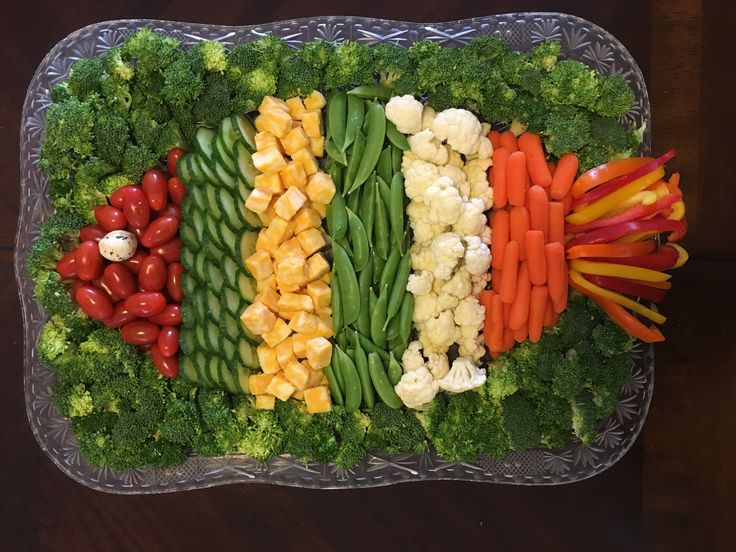 a platter filled with lots of different types of vegetables