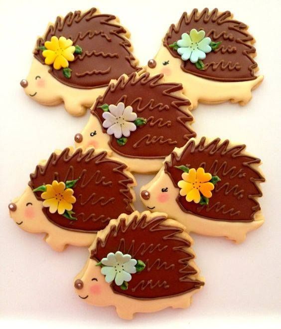 hedgehog cookies decorated with chocolate frosting and flowers