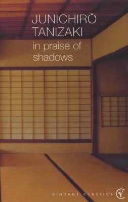 an old book with the title in praise of shadows, written by shinchiro tanizaki