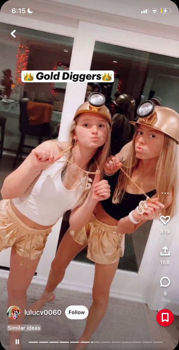 two girls dressed up as gold diggers posing for the camera