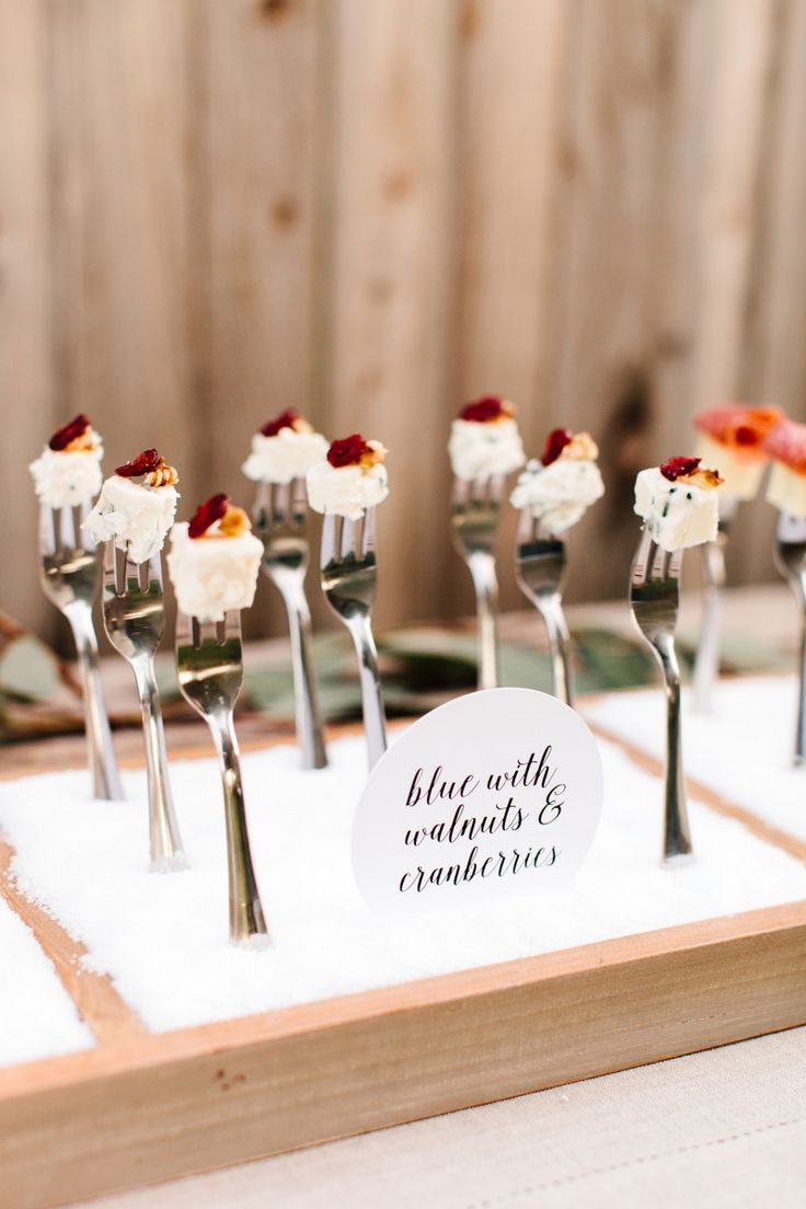 there are forks with small desserts on them