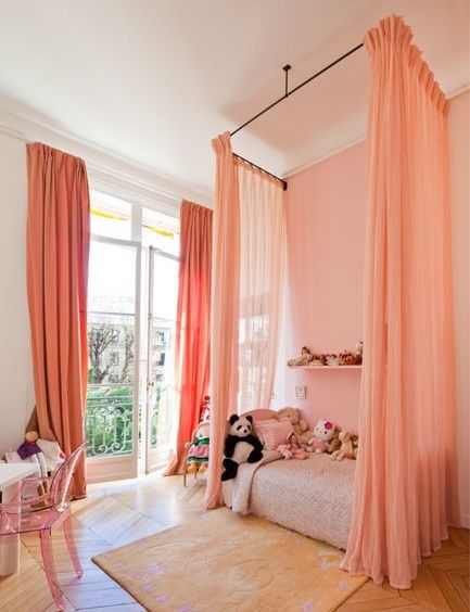 a room with pink curtains and a bed in the corner, on instagram for happykidsidecor