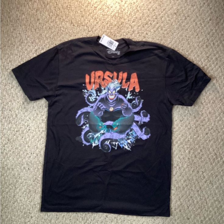 Disney Ursula T-Shirt. Graphics On Front And Back. Black Disney Graphic Tee, Disney Ursula, Universal Studios Halloween, Disney Princess Half Marathon, Shirt Graphics, Tie Shorts, Disney Tees, Run Disney, Disney Shirt