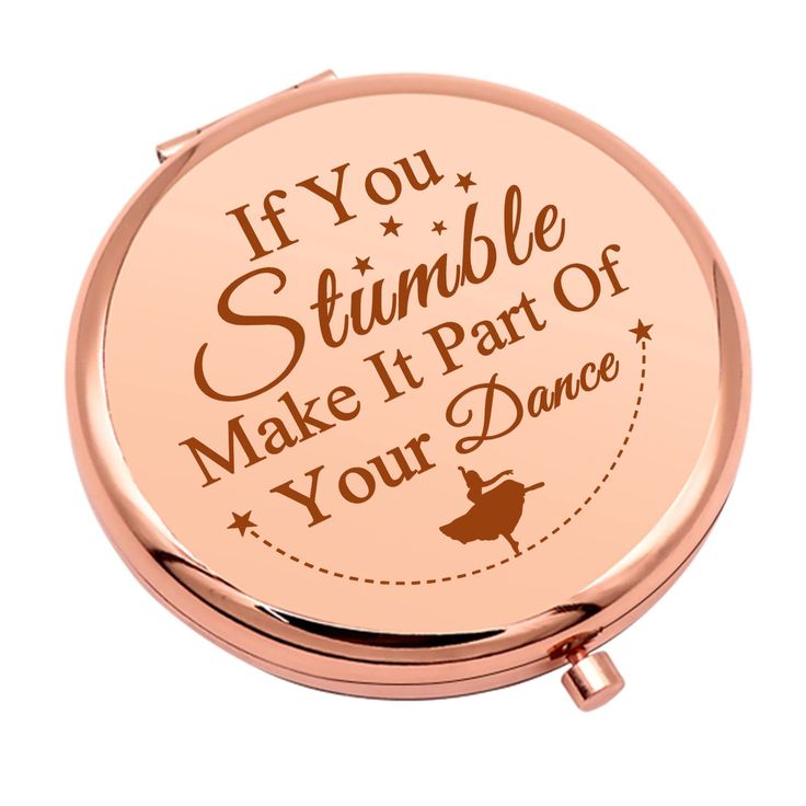 a compact mirror with the words if you stumble make it part of your dance on it