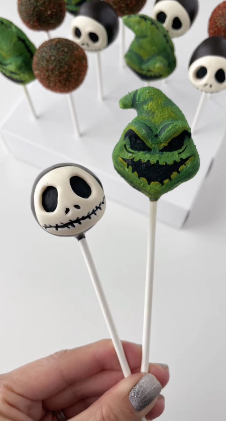 there are many halloween lollipops with faces on them