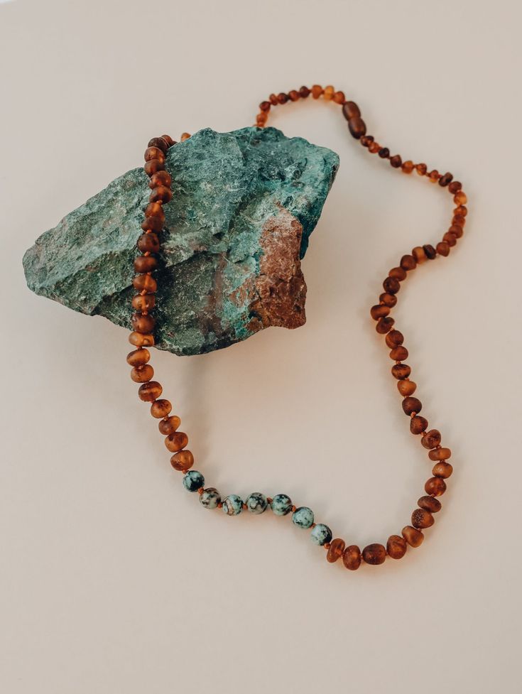 Our jewelry is handmade using original Baltic Sea Amber that is over 45 million years old. Baltic Amber has some of the highest concentrations of Succinic Acid found in nature and this is what makes it so special. Fossilized tree sap that has been preserved for millions of years under the sea. It is a true gift from Mother Nature. The string on each of our necklaces and bracelets is knotted by hand in between each and every bead, so should the necklace break (which it should if necessary), the r Lava Jewelry, Tree Sap, Baltic Amber Necklace, Amazonite Necklace, Natural Parenting, Teething Necklace, Jasper Necklace, Amber Bracelet, Amber Necklace