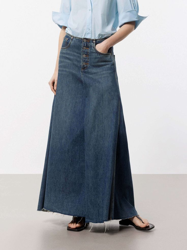 MO&Co. Women's A-line Maxi Denim Skirt This denim skirt features an A-line maxi silhouette, a flattering and versatile style that falls gently away from the body. Crafted from premium cotton, this skirt features a pleated and raw hem design that adds a unique and trendy touch, while the deep blue hue gives it a classic and timeless look. Pair with a cute top or tucked-in blouse for a chic outfit. Features : - Mid waist A-line maxi silhouette- Classic five pocket design- Pleated and raw hem desig Full-length Denim Blue Maxi Skirt, Denim Blue Full-length Maxi Skirt, Full Length Denim Blue Maxi Skirt, Dark Wash Denim Maxi Skirt, Blue Denim Full-length Maxi Skirt, Relaxed Full Length Denim Skirt In Medium Wash, Medium Wash Full Length Relaxed Denim Skirt, Full-length Denim Skirt With Frayed Hem, Full Length Denim Skirt With Frayed Hem