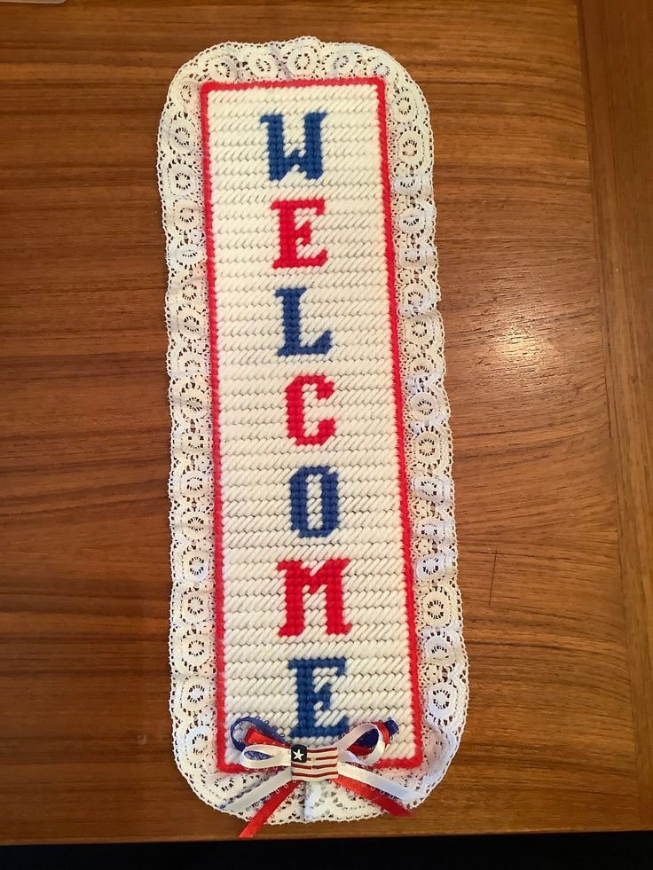 a welcome sign made out of plastic beads