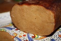 a loaf of bread sitting on top of a colorful plate