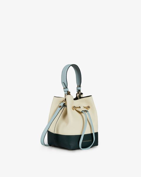 A modern take on the classic bucket bag, our best-selling Osette is your perfect everyday companion. Deceptively spacious, the soft structure is handcrafted in Spain from buttery-soft pebble finished leather and features an elegant drawstring closure, complete with our signature music bar. This compact yet versatile silhouette can be carried in hand by the leather top-handle, or styled as a crossbody bag with the detachable leather strap. Inspired by the captivating allure of Ibiza's landscapes, immerse yourself in a boheimian vibe this season. Drawing influence from the untamed beauty of North Ibiza in winter, explore the island's artistic soul though this collection of best-selling silhouettes, reimagined in tones of the tranquil blue sky and purity of the white-washed architecture. Addi Elegant Green Top Handle Bucket Bag, North Ibiza, Elegant Luxury Bucket Bag With Silver-tone Hardware, Top Handle Bucket Bag With Silver-tone Hardware, Elegant Bucket Bag With Silver-tone Hardware And Top Handle, Bucket Bag With Silver-tone Hardware And Double Handle, Music Bar, Tranquil Blue, Handbags Collection