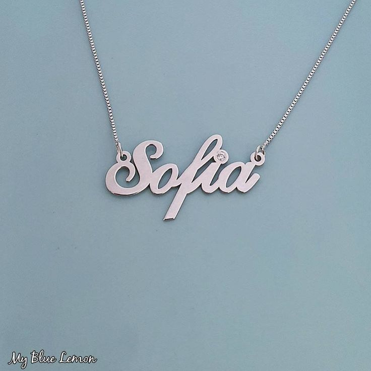 Order any single name or word, for your new 14k White Gold Sofia style name necklace!  If you would like to add Genuine Swarovski Birthstone for the dot of the i, or the first capital letter, choose this option in the menu provided. * Nameplate and chain are all Solid 14k White Gold. Stamped 14k for authenticity. * First capital letter is exactly 11mm (0.4 inches). Standard Size name necklace. * Nameplate is 0.8 high quality thickness, or my double premium upgraded 1.1mm thickness. * In the lead Engraved White Gold Nameplate Necklace, Engraved White Gold Custom Nameplate Necklace, White Gold Nameplate Jewelry With Names, Mother's Day White Gold Name Necklaces, Custom Name White Gold Nameplate Necklace, Personalized White Gold Nameplate Necklace, Classic Custom Name Necklace For Personalized Gift, Classic Custom Necklace For Personalized Gift, White Gold Name Necklace Custom Name Gift