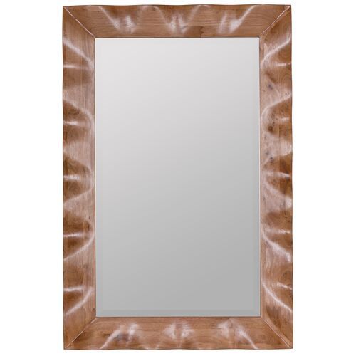 a wooden frame mirror sitting on top of a white wall