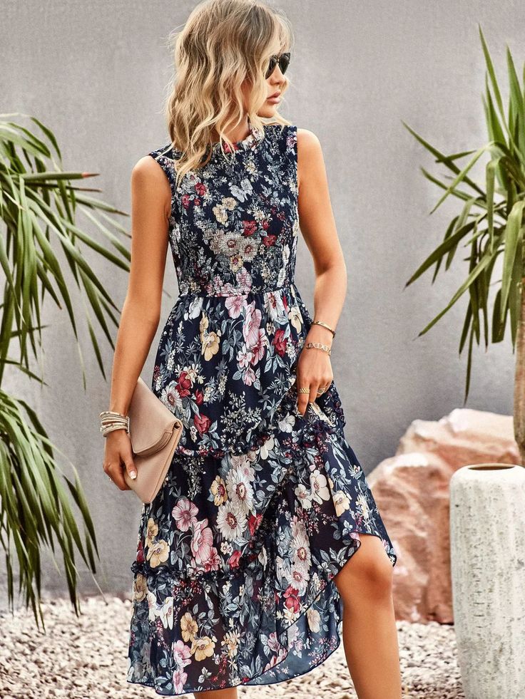 Step out in style with the beautiful Ncocon floral dress - the perfect choice for any evening occasion! This stunning dress features an elegant floral print on a lightweight, airy woven fabric. The dress is designed with a sophisticated mock neck , sheer decolletage, and short sleeves, along with a darted bodice to create a flattering and feminine silhouette. The elastic waist tops a tiered skirt that flows to a modest midi length, adding a touch of elegance to your look. Pair it with strappy heels and a clutch for the perfect date night outfit, or dress it down with sandals for a more casual daytime look. Fabric name: chiffonPattern: plants and flowersTechnology: printingSkirt type: A-line skirtCollar type: semi-high collarType: high waistPopular element: wooden earColor: navy blue, pink, High Neck Midi Dress, Tiered Maxi Skirt, Self Design, Elegant Floral, Floral Sleeveless, Online Fashion Stores, Sleeveless Maxi Dress, Tiered Skirt, Tiered Dress