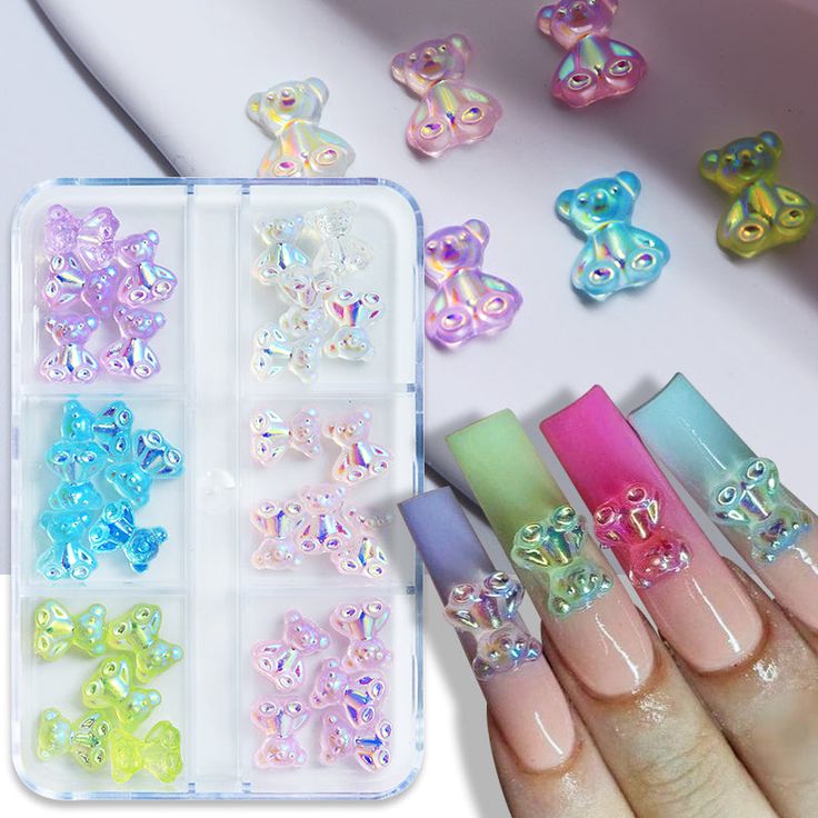 6 Grids 3D Cute Resin Bear Nail Charms Colorful Bear Rhinestones Nail Art Decorations Supplies Accessories Product information Size:7.5*9mmPacking:30Pcs/boxMaterial:resinColor:as the picture shownShape:bear nail charms Usage Instructions: 1.Clean the surface of nails, do some basic UV gel polish, better to apply on a transparent base coat first. 2. Apply UV color gel. 3. Use tweezers to take out an amount of charms, press the sequins on the nails with some gel glue. 4. Make sure the nail charms Carebear Nail Ideas, Teddy Bear Charm Nails, Gummy Bear Nails, Jelly Art, Bears Nails, Korean Nail Art, Gel Glue, Nail Art For Beginners, Korean Nails