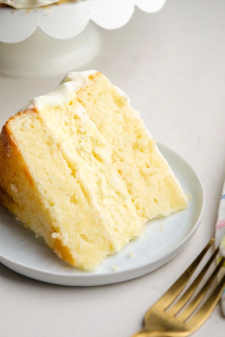 a piece of cake on a plate next to a fork