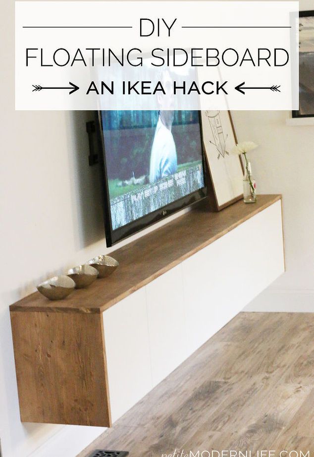 a flat screen tv sitting on top of a wooden entertainment center in a living room