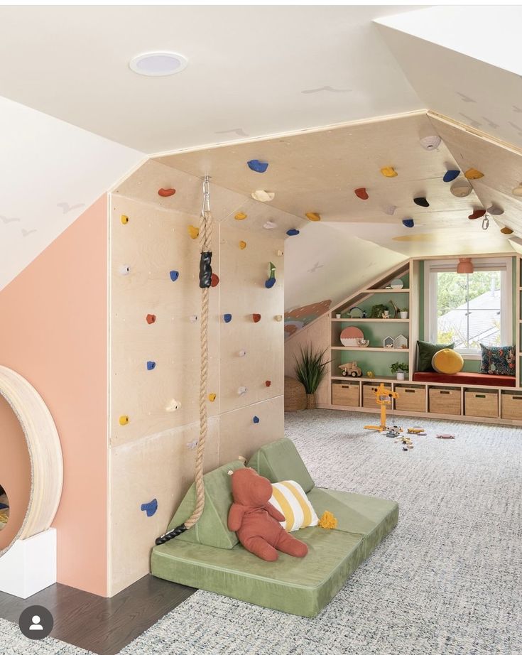 a child's bedroom with climbing walls and toys