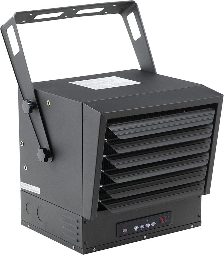 a black portable heater sitting on top of a white surface