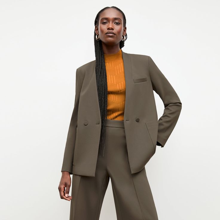 The Janette jacket is the very embodiment of modern suiting. Crafted from lightweight Italian ponte, it features an easy fit and a secretly-wearing-pajamas feel. Meanwhile, the collarless design creates a sharp, streamlined look. Made in China with fabric from Italy. Modern Tailored Long-sleeve Pantsuit, Tailored Structured Office Pantsuit, Tailored Structured Pantsuit For Office, Modern Tailored Long Sleeve Pantsuit, Modern Business Casual Pantsuit, Modern Spring Outerwear With Pressed Crease, Classic Tailored Fall Pantsuit, Sleek Structured Spring Blazer, Classic Tailored Pantsuit For Fall