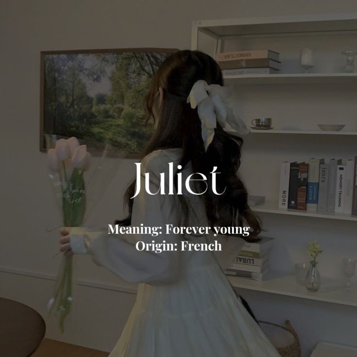 a girl in a white dress holding flowers with the words juliet on it