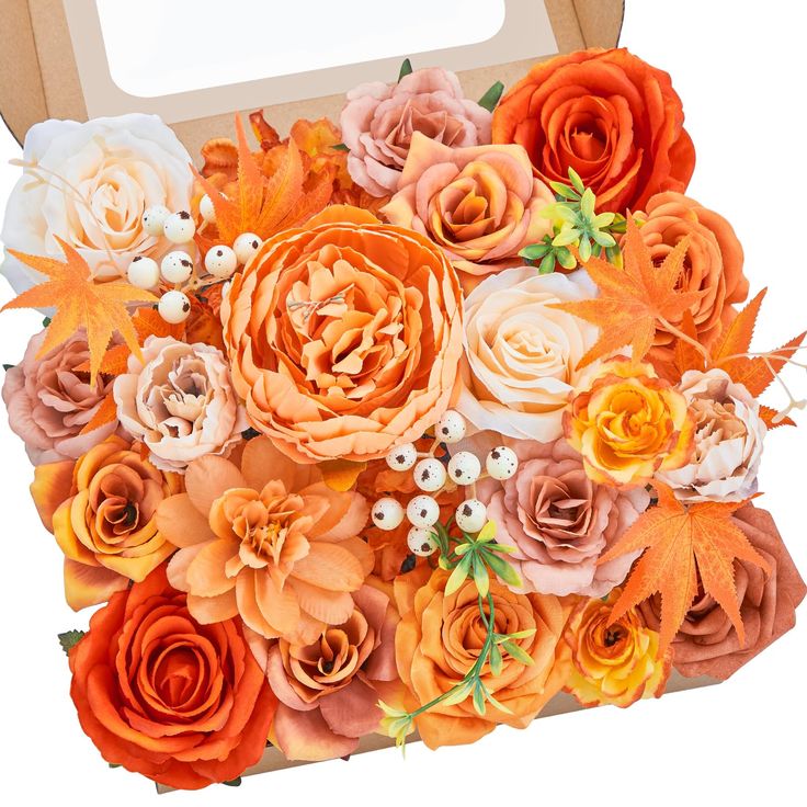 an open box filled with lots of different colored flowers