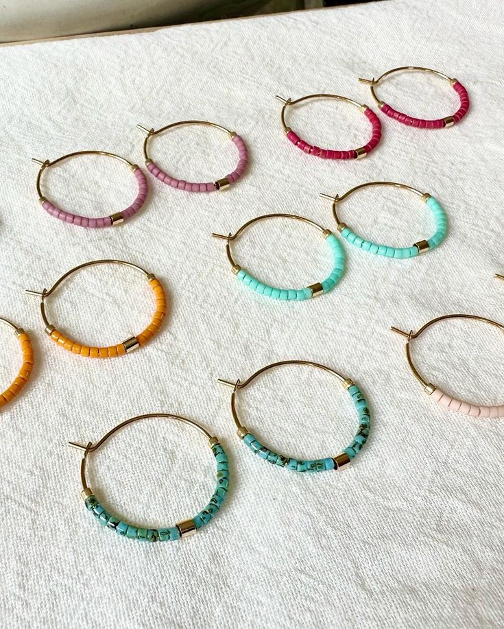 Handmade to order. Super colorful hoops, perfect for summer! Very light weight, gold plated hoops. Made with very high quality Japanese beads. Size: 3/4 inch hoops. 🌎 Packaging 🌎 To be environmentally responsible about packaging we will package orders together in the same box. If certain items in your order are intended as gifts and you'd like individual boxes, please leave a note during checkout. To view more items from this shop, click the link below:  https://www.etsy.com/shop/OceanBreakup Package Orders, Seed Bead Hoop Earrings, Little Hoop Earrings, Bead Hoop Earrings, Japanese Beads, Earrings Colorful, Earrings Minimalist, Beaded Hoop Earrings, Beaded Hoops