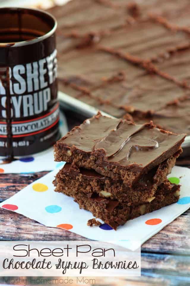 two pieces of chocolate brownie sitting next to a cup of coffee