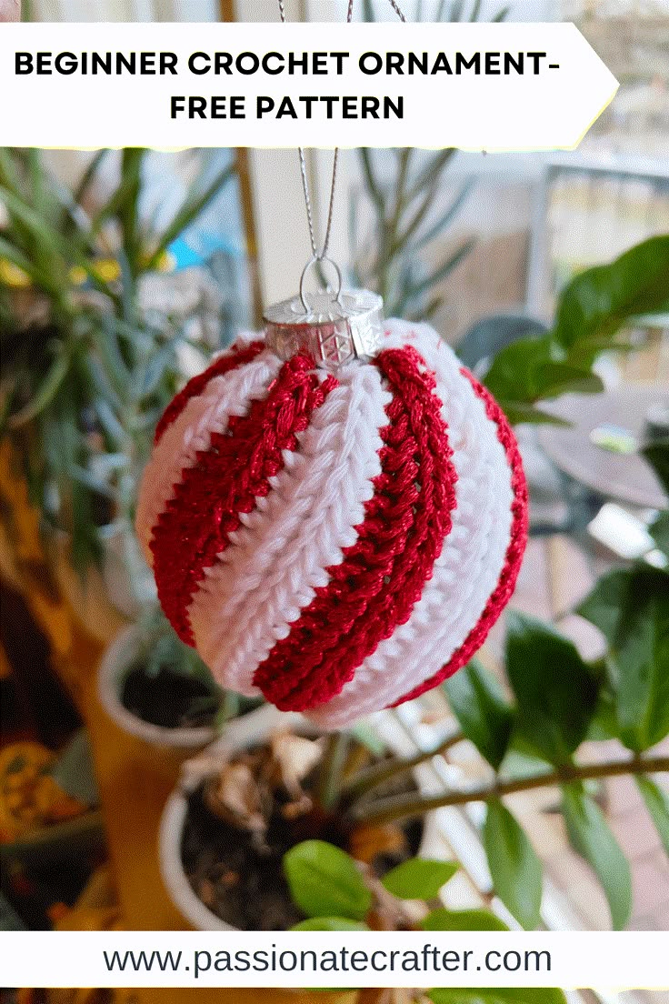 a crocheted christmas ornament hanging from a tree