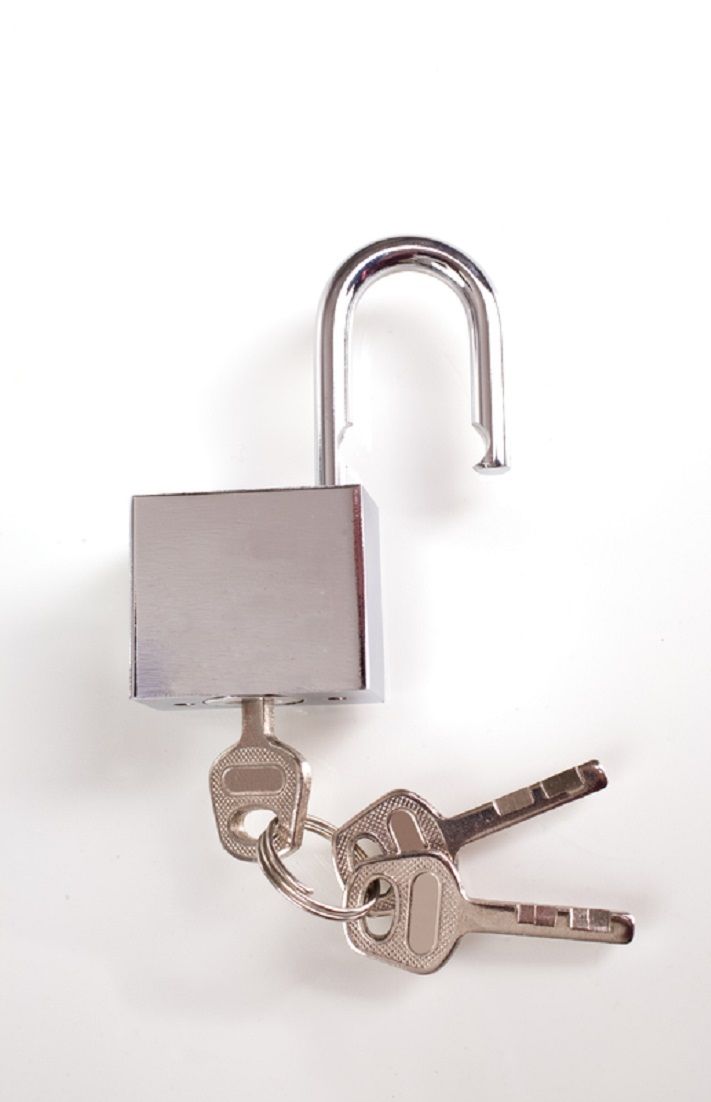 two keys attached to a padlock on a white background