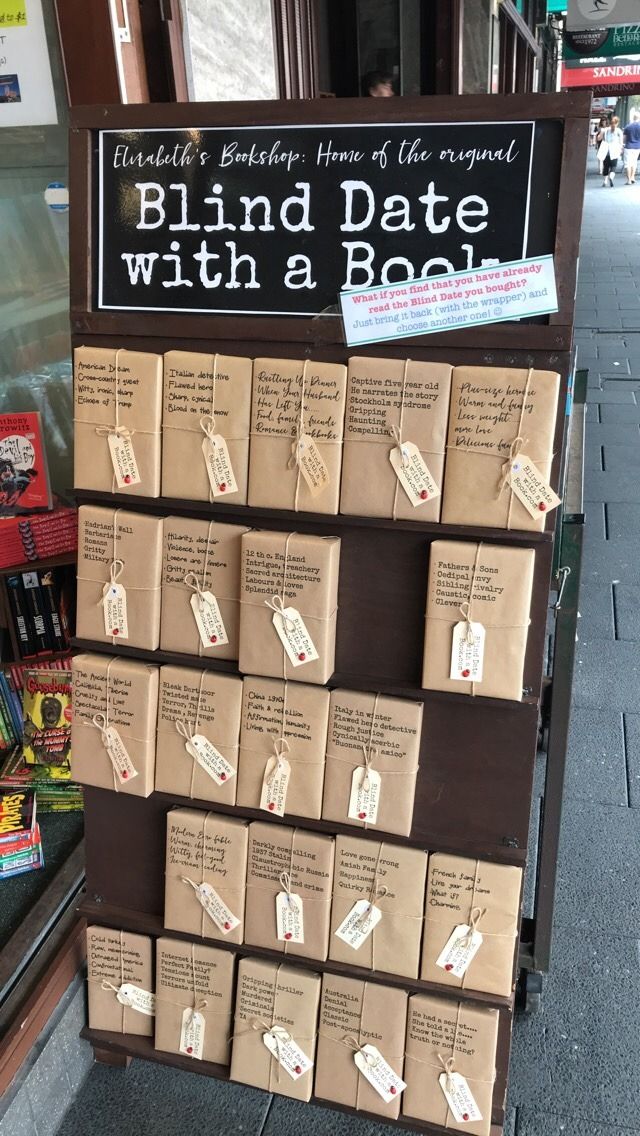 a sign that is on the side of a building advertising blind date with a book