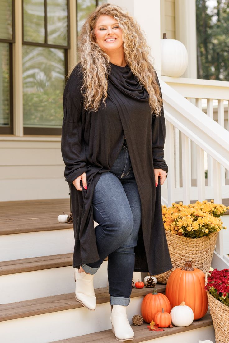 Wrap yourself in warmth with this unique black cardigan! This cutie has a cool design on the shoulders and has a fun split along the front and back! Style this over a tank or cami and skinnies for an easy to wear look! 73% Rayon, 22% Polyester, 5% Spandex Black Cardigan For Fall Loungewear, Black Cardigan For Loungewear And Fall, Edgy Sweater For Fall Layering, Edgy Sweater For Layering In Fall, Edgy Fall Sweater For Layering, Edgy Layering Sweater For Fall, Versatile Black Sweater For Loungewear, Cozy Stretch Black Tops, Black Sweater For Loungewear In Fall