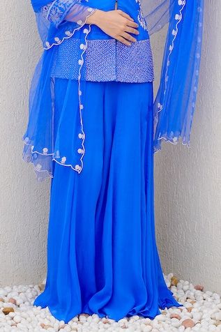 Royal blue short kurta embellished with bird and flower motif. Paired with a flared palazzo and a dupatta with scalloped embroidered border. - Aza Fashions Blue Palazzo Set With Dabka Work For Party, Elegant Blue Embellished Traditional Wear, Festive Blue Hand Embellished Choli, Fitted Blue Sets With Mirror Work, Blue Embellished Salwar Kameez For Navratri, Blue Anarkali Set Hand Embellished, Designer Hand Embellished Blue Dupatta, Elegant Blue Sets For Navratri, Elegant Blue Sets With Mirror Work