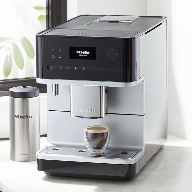 an espresso machine sitting on top of a counter