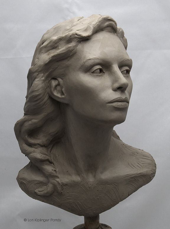 a sculpture of a woman's head is shown