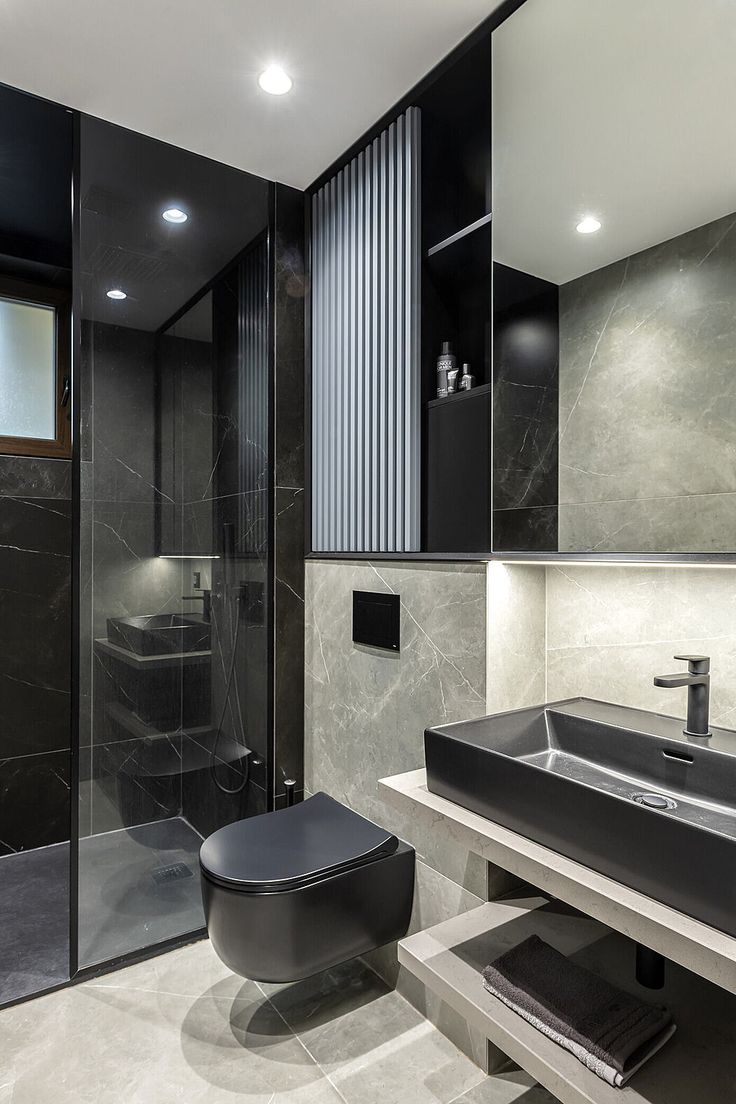 a modern bathroom with black and white decor