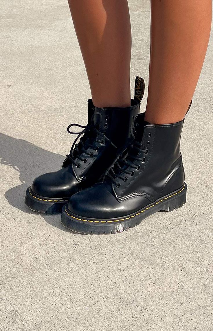 * Black Boot by Dr Martens () 
 * This staple boot will be your go - to shoe () all year round! Style with a black mini for a grungy/cool girl look or simply wear with jeans and a blazer for a cool winter-y look! 
 * Pull tab for easy entry 
 * Lace up fastening 
 * Chunky sole 
 * Yellow contrast stitching 
 * Round toe Dr Martens Bex, Doc Marten Boot, Summer Bottoms, Prom Midi Dress, Shop Boots, 60's Dress, Summer Playsuit, Crochet Sandals, Amy Rose