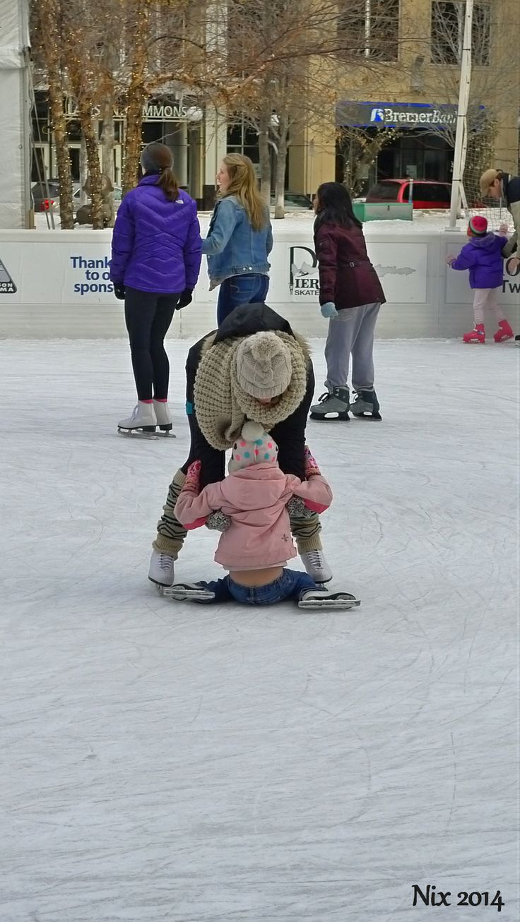 several people are skating on an ice rink