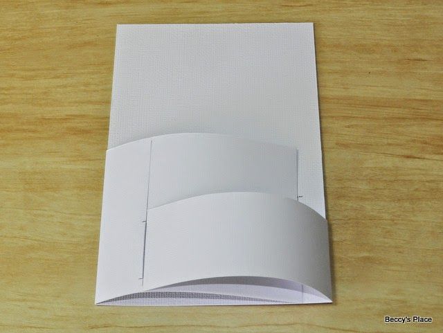 an open white paper on top of a wooden table