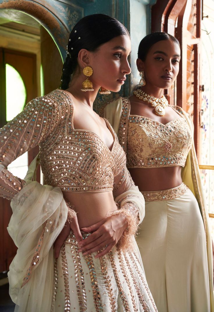 A stunning off-white lehenga with a gold embroidered blouse and skirt bottom.From Bindani’s Rang Mahal collection DELIVERY TIMEPlease allow 8-12 weeks for your outfit to arrive. FABRIC DETAILSHabutai silk Professional cleaning only. Elegant Off-white Lehenga For Festive Occasions, Elegant Cream Lehenga For Festive Occasions, Designer Cream Sets With Traditional Drape, Elegant Off White Lehenga With Traditional Drape, Elegant Cream Choli With Traditional Drape, Elegant Off White Lehenga For Festive Occasions, Off White Sets With Intricate Embroidery For Transitional Season, Off White Embroidered Sets For Transitional Season, Off White Embroidered Transitional Sets