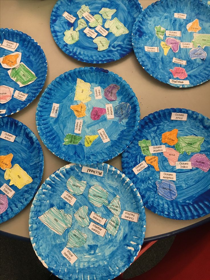 paper plates with different types of fish on them are arranged in the shape of a map