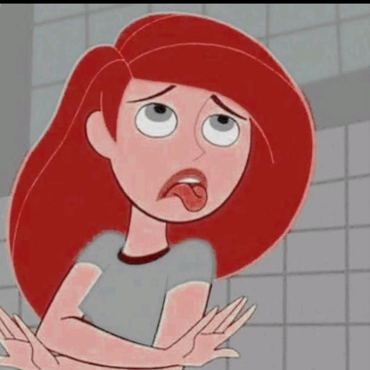 an animated woman with red hair standing in front of a tiled wall